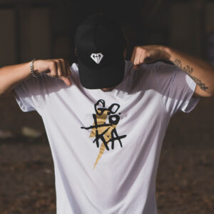 GOLOKA Soul'diers collection lookbook cover: model flexing in a white graphic t-shirt and diamond-logo cap