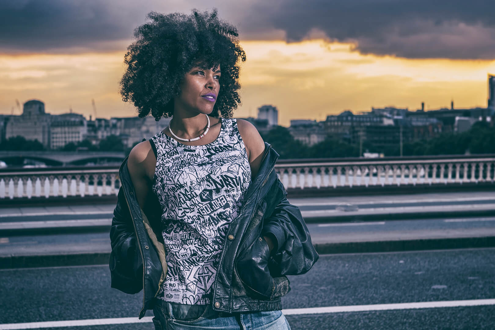GOLOKA Women category: model in a graffiti print tank top and leather jacket