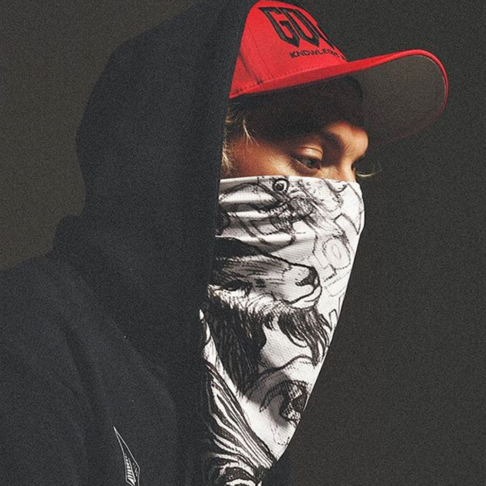 GOLOKA Knowledge Bliss Eternity lookbook cover: model in a red cap, black hoodie and graphic bandana face mask